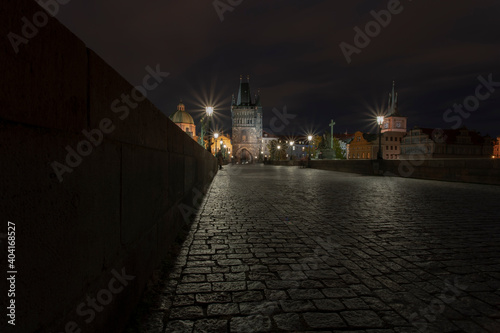 .cobblestones and street lights on Charles Bridge at night in the Czech Republic