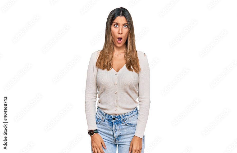 Obraz premium Young woman wearing casual clothes afraid and shocked with surprise expression, fear and excited face.