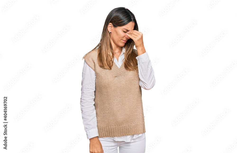 Fototapeta premium Young woman wearing casual clothes tired rubbing nose and eyes feeling fatigue and headache. stress and frustration concept.