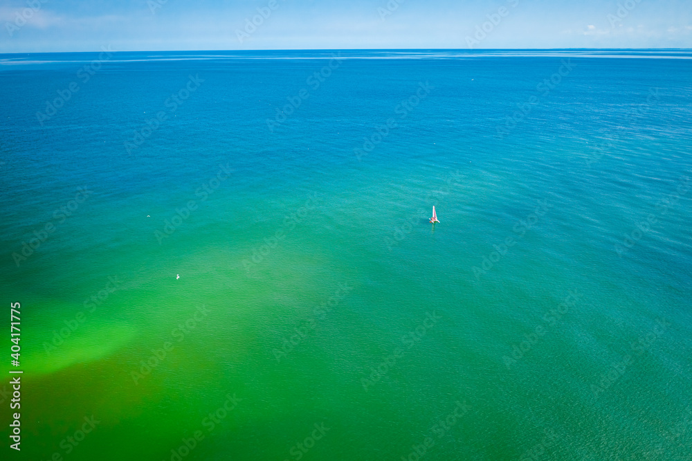 Big Baltic Sea and lonely one boat, aerial view