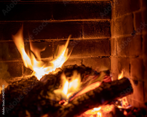 tongues of fire in a heated stone fireplace, horizontal