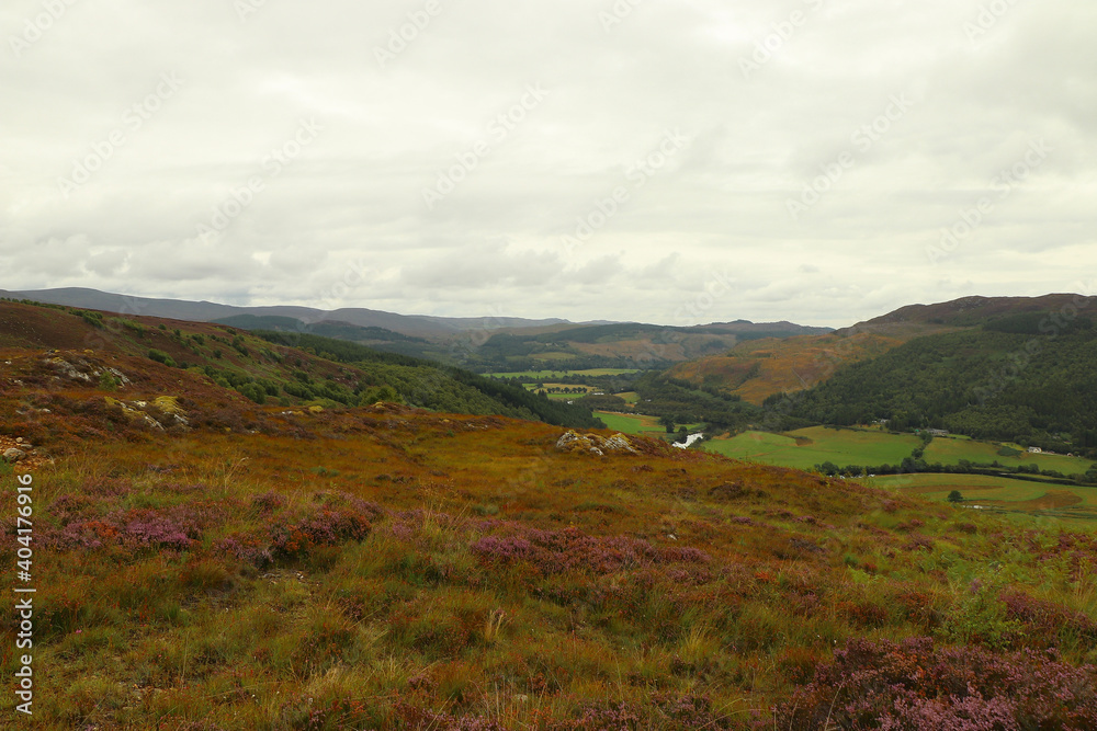 A view down from the hills of Scotland to the glens, rivers and lochs below