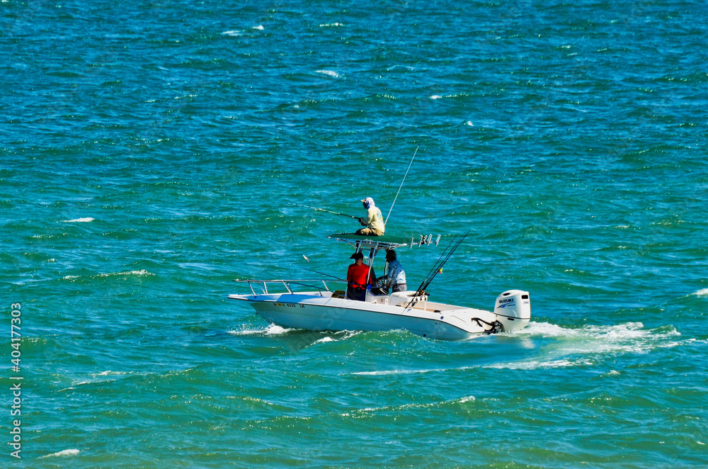Boaters in Ocean Fishing with Negative Space