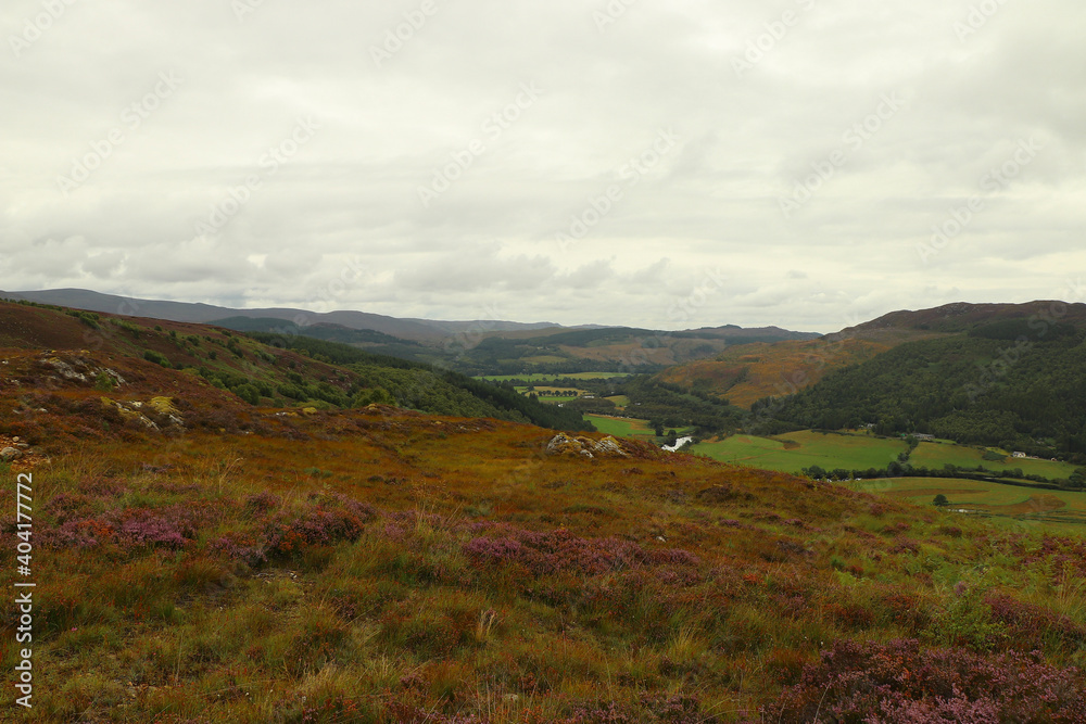 A view down from the hills of Scotland to the glens, rivers and lochs below