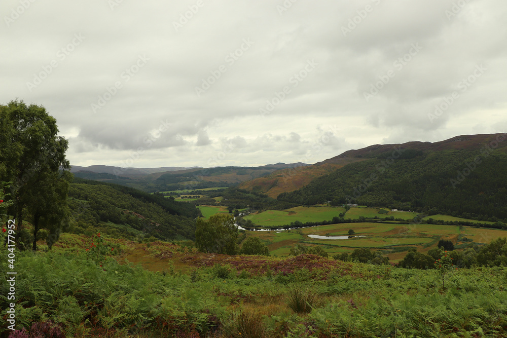 A view down from the hills of Scotland to the glens, rivers and lochs below