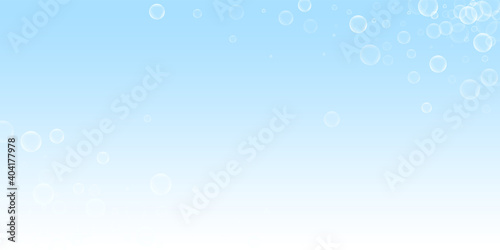Random soap bubbles abstract background. Blowing bubbles on winter sky background. Breathtaking soapy foam overlay template. Brilliant vector illustration.