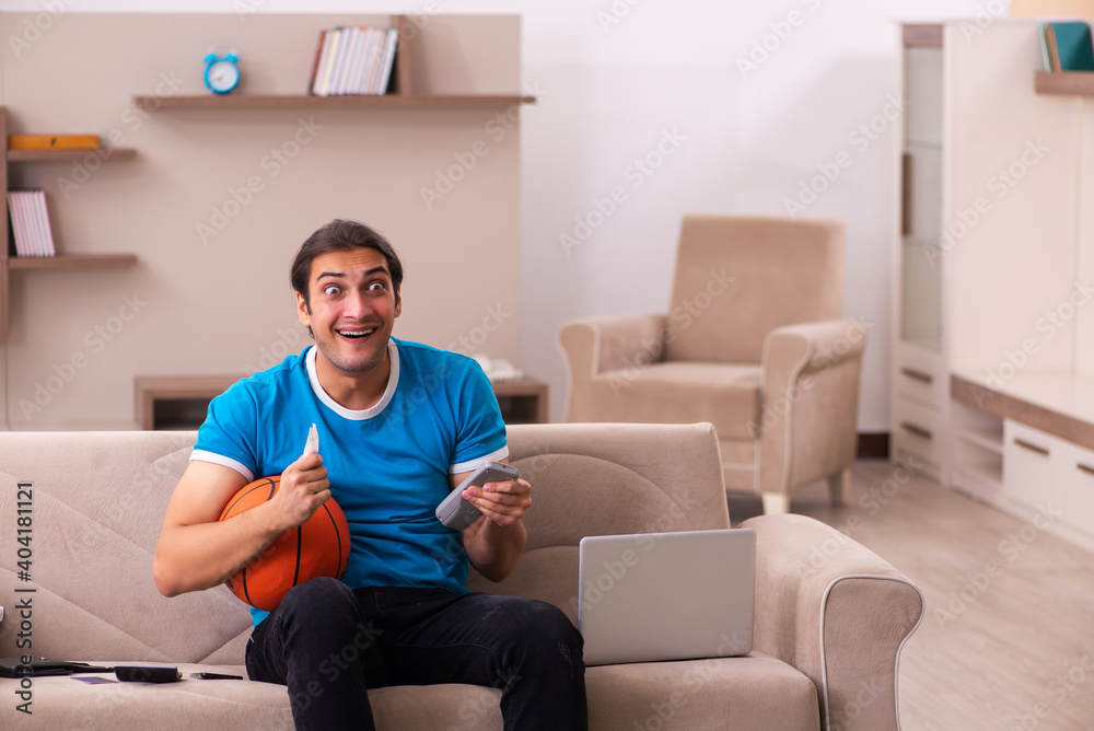Sport bet addicted young man betting at home Sport bet addicted young man betting at home