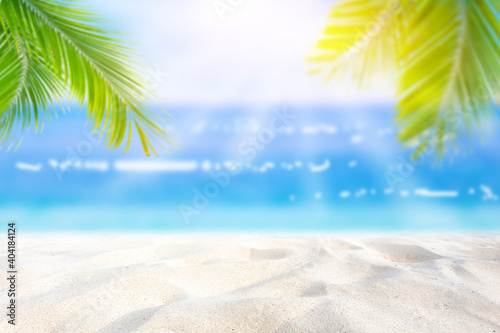 Summer background. Sea and sand, sunlight The tropical beach is blurry with abstract bokeh. Copy space for holiday makers and concepts.