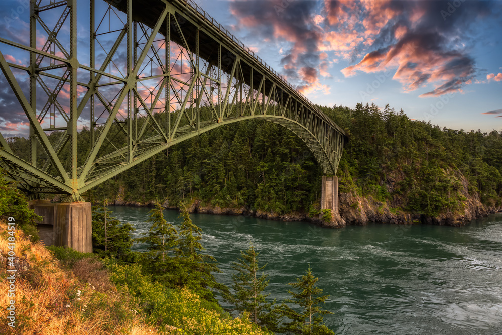 Iconic Bridge, Deception Pass, on the West Pacific Ocean Coast. Washington, United States. Colorful Sunset Sky Art Render.