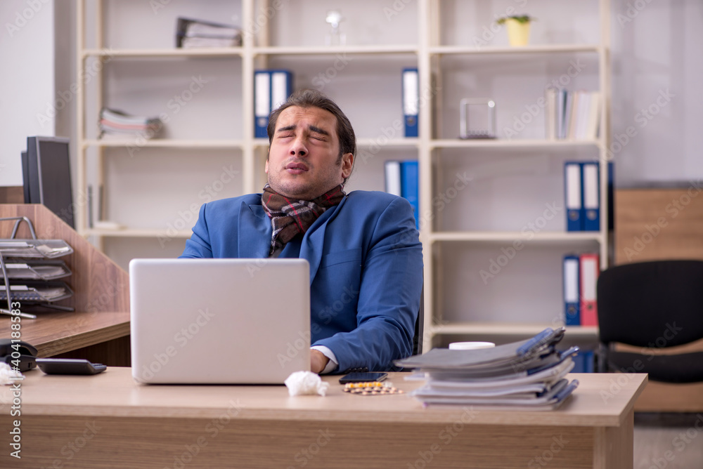 Young sick businessman employee suffering at workplace Young sick businessman employee suffering at workplace