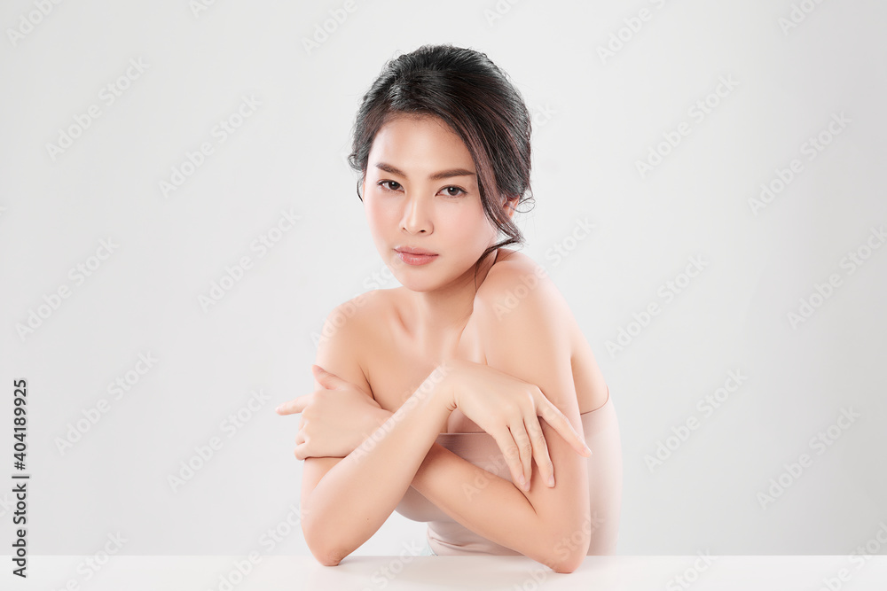 Obraz premium Beautiful Young asian Woman with Clean Fresh Skin, on Pink background, Face care, Facial treatment. Cosmetology, beauty and spa. Asian women portrait