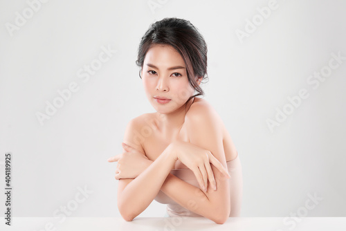 Beautiful Young asian Woman with Clean Fresh Skin  on Pink background  Face care  Facial treatment. Cosmetology  beauty and spa. Asian women portrait