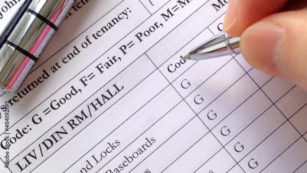 Woman signing a tenancy agreement and checking whole equipment in good condition Woman signing a tenancy agreement and checking whole equipment in good condition