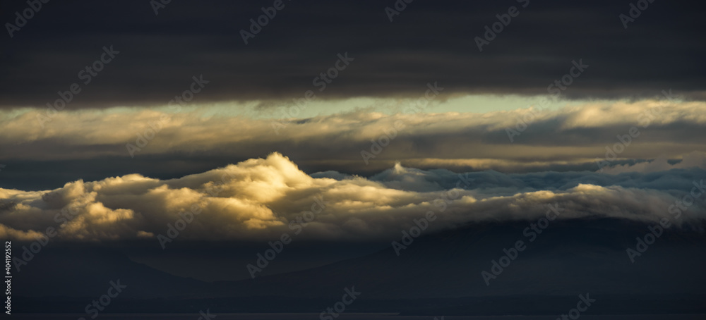 Naklejka premium Sunset, cloudy sky, mountains and Atlantic ocean in Co. Donegal, Ireland