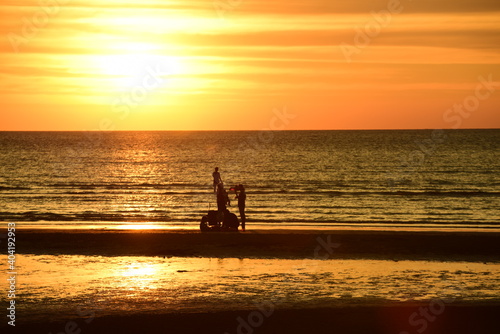 Wallpaper Mural Beautiful golden yellow sky and sun The view of the beach, the beach and the sun loungers are rising. Beautiful golden yellow sky and sun	 Torontodigital.ca