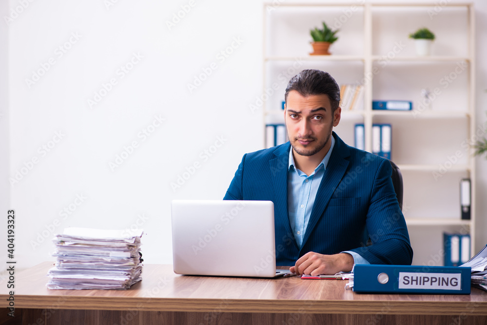 Young male businessman employee working in the office Young male businessman employee working in the office