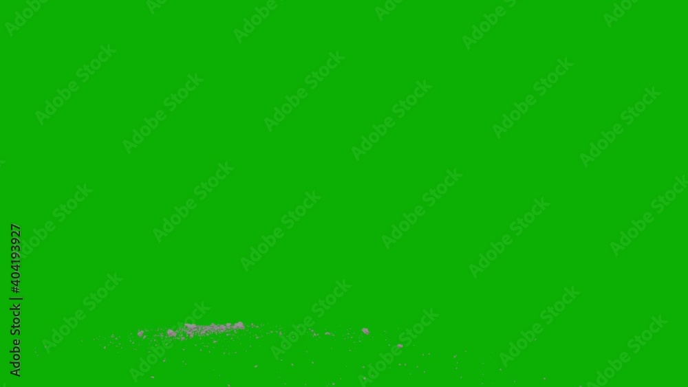 Dusty bullet hits on a wall with chunks of debris flying out . Powder explosion on black background. Impact dust particles. Green screen background side long view