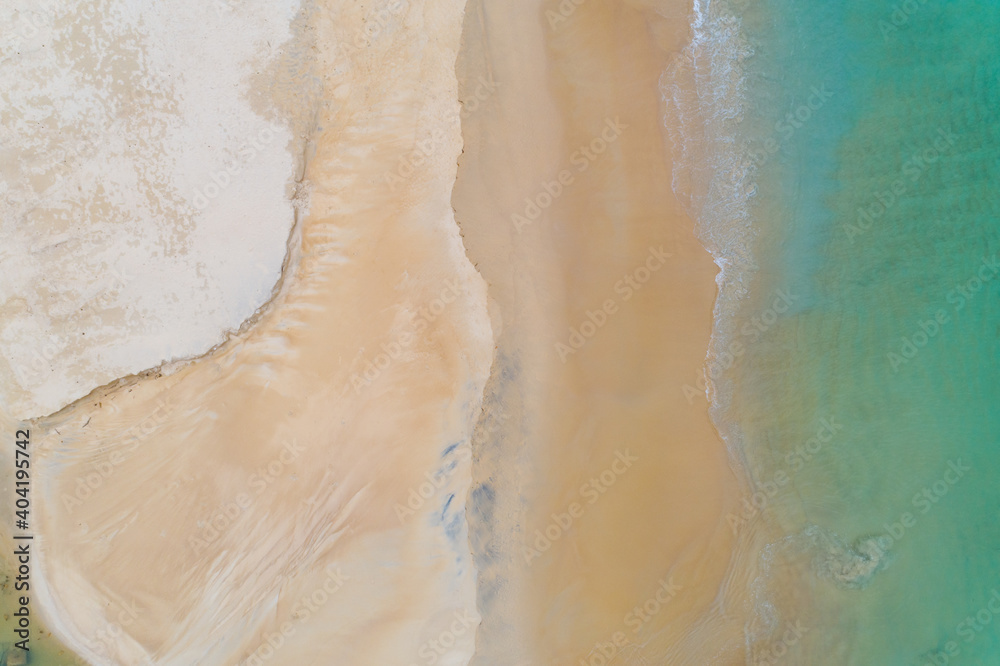 Aerial view Top Down of Beautiful sea summer or beach and tropical sea background,soft turquoise ocean wave crashing on sandy shore in summer season sunny day,Nature and travel background concept Aerial view Top Down of Beautiful sea summer or beach and tropical sea background,soft turquoise ocean wave crashing on sandy shore in summer season sunny day,Nature and travel background concept
