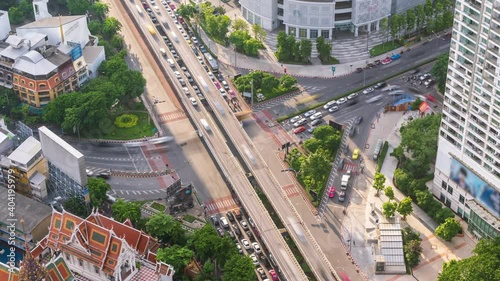 Bangkok business district city center above Samyan intersection and traffic, with buildings and skyscrapers, during rush hour - Time Lapse photo