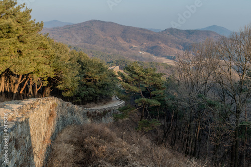 Landscape of fortress wall and mountains. photo