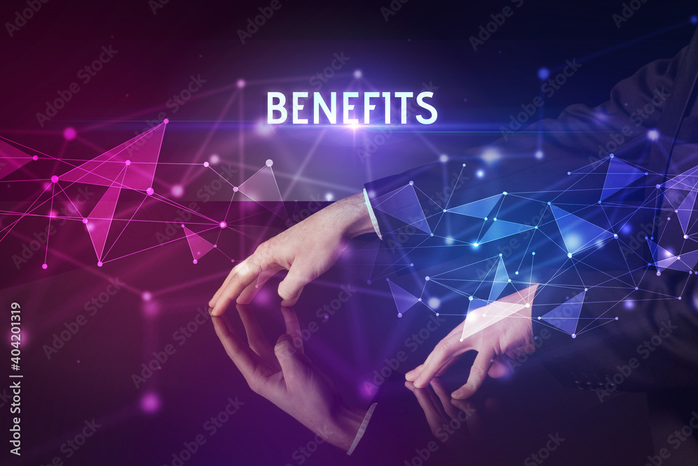 Businessman touching huge screen with BENEFITS inscription, modern technology business concept Businessman touching huge screen with BENEFITS inscription, modern technology business concept