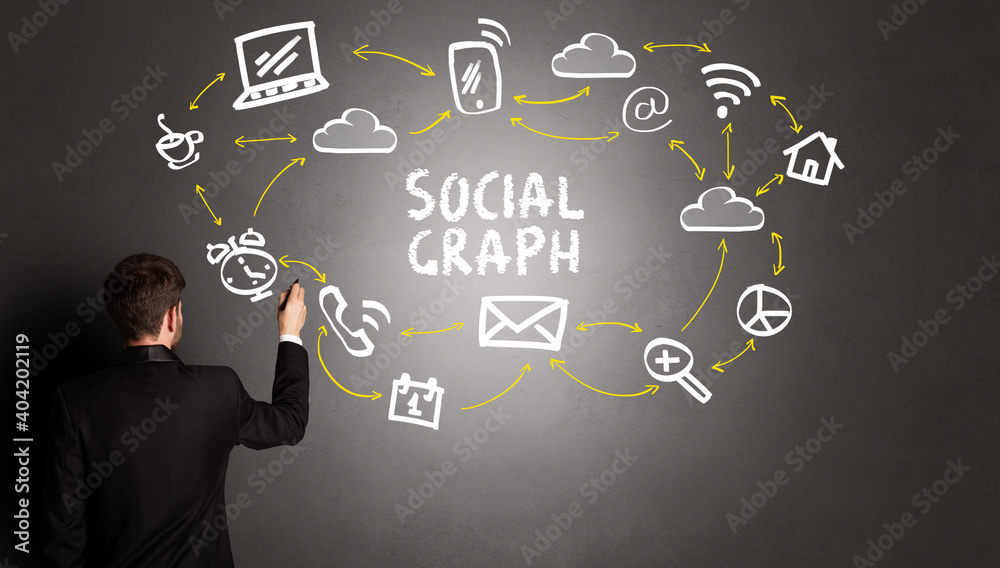 businessman drawing social media icons with SOCIAL GRAPH inscription, new media concept businessman drawing social media icons with SOCIAL GRAPH inscription, new media concept