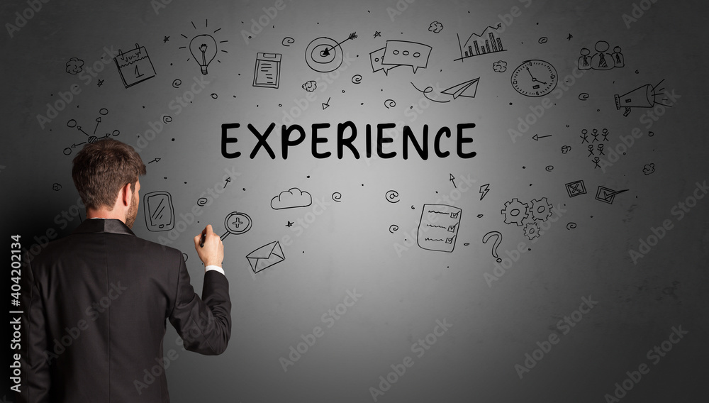 businessman drawing a creative idea sketch with EXPERIENCE inscription, business strategy concept businessman drawing a creative idea sketch with EXPERIENCE inscription, business strategy concept