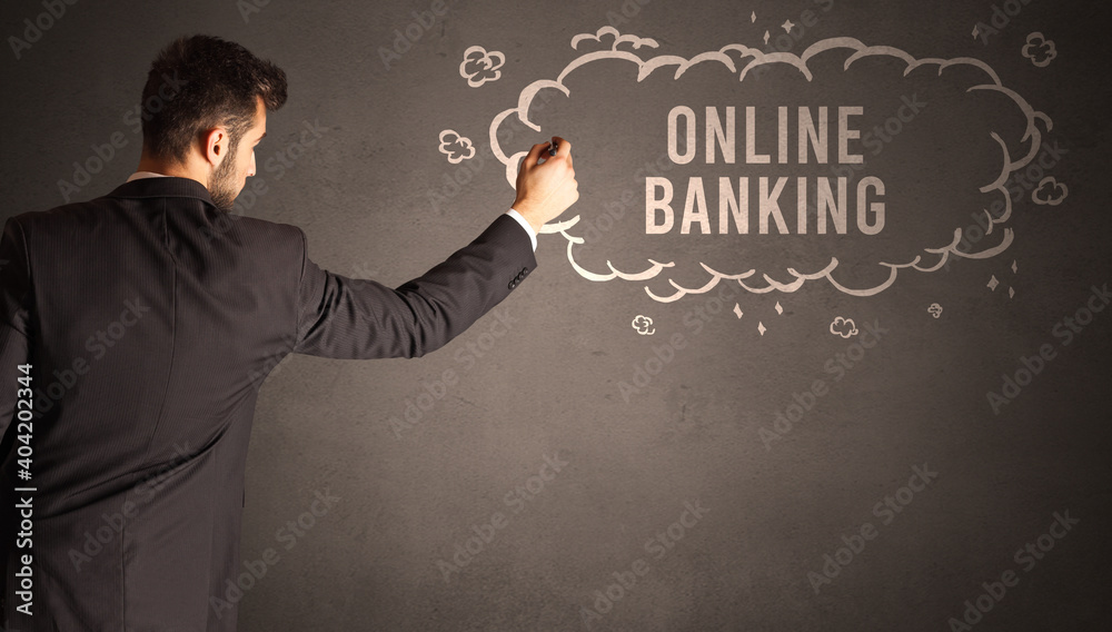 businessman drawing a cloud with ONLINE BANKING inscription inside, modern business concept businessman drawing a cloud with ONLINE BANKING inscription inside, modern business concept