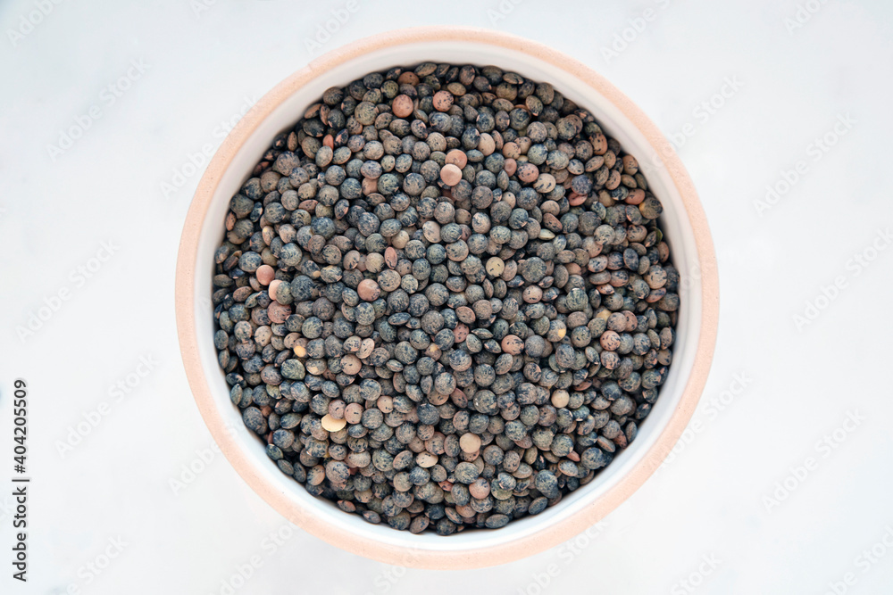 Close-up of a bowl of raw lentils Close-up of a bowl of raw lentils