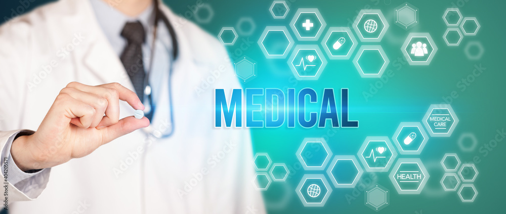 Close-up of a doctor giving you a pill with MEDICAL inscription, medical concept Close-up of a doctor giving you a pill with MEDICAL inscription, medical concept
