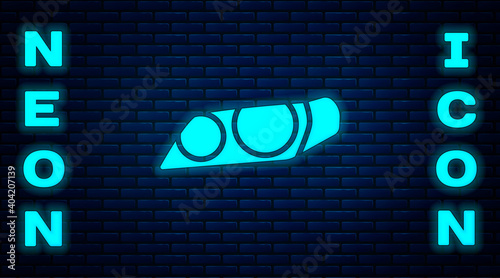 Glowing neon Car headlight icon isolated on brick wall background. Vector Illustration.
