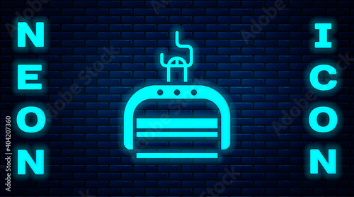 Glowing neon Ski lift icon isolated on brick wall background. Vector Illustration.