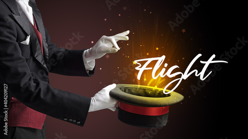 Magician is showing magic trick with Flight inscription  traveling concept
