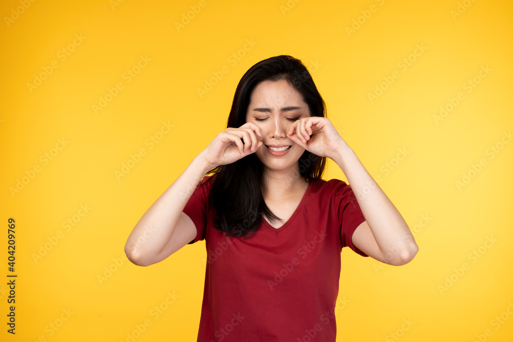 Young woman crying and weeping in tears. Portrait of beautiful young woman depressed, bad mood and cry. Beautiful Asian woman feeling sad, she cried with tears from eyes. Sad young Asian woman cry. Young woman crying and weeping in tears. Portrait of beautiful young woman depressed, bad mood and cry. Beautiful Asian woman feeling sad, she cried with tears from eyes. Sad young Asian woman cry.