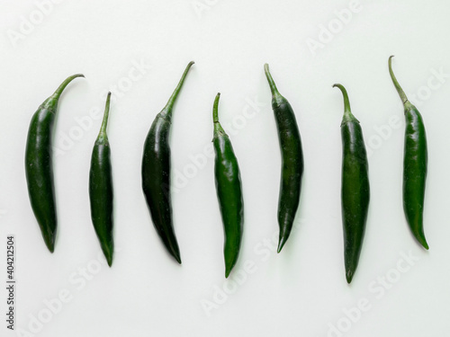 Green hot chilli peppers with seed. Food background. Top view. Chili pepper isolated on white background. Ripe chili pepper Clipping Path.