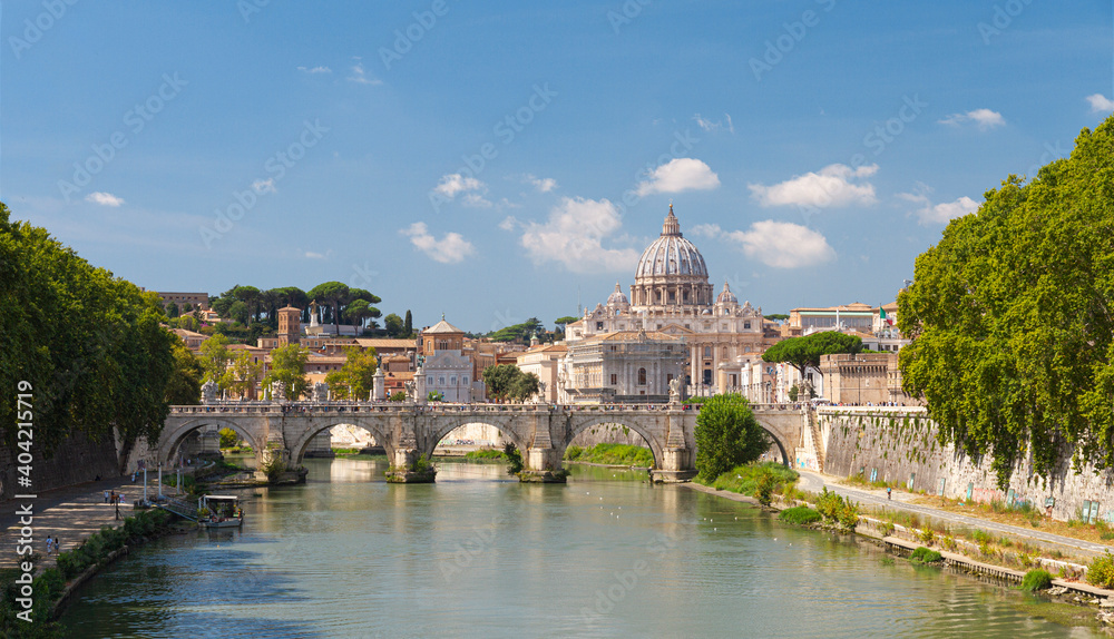 Sant'Angelo bridge (Ponte Sant’Angelo) on Tiber river and Saint Peter’s Basilica in Rome, Italy 