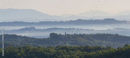 фотографія Scenic view of foggy dawn on the hills - Fogg is rising from vineyards and hiils