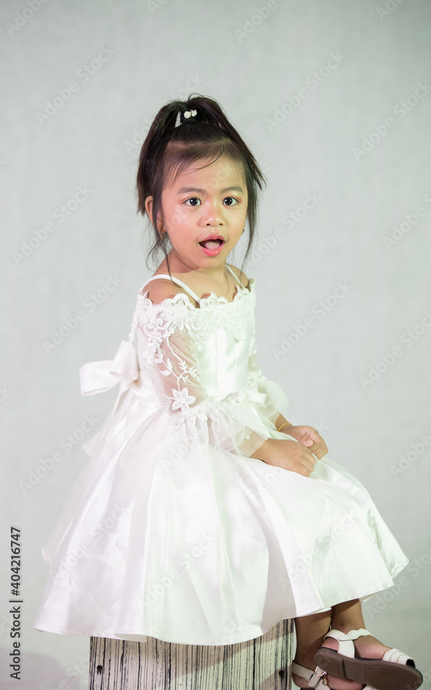 Little princess in white dress looks so adorable Little princess in white dress looks so adorable