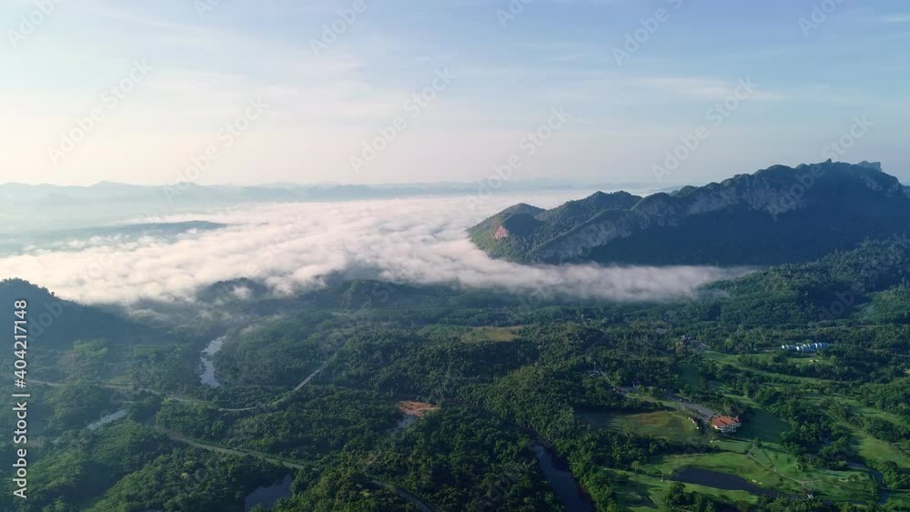 Aerial view of sunrise over foggy mountains,Amazing foggy mountains, Clouds under mystical valley, Drone flight over the forest Aerial view of sunrise over foggy mountains,Amazing foggy mountains, Clouds under mystical valley, Drone flight over the forest