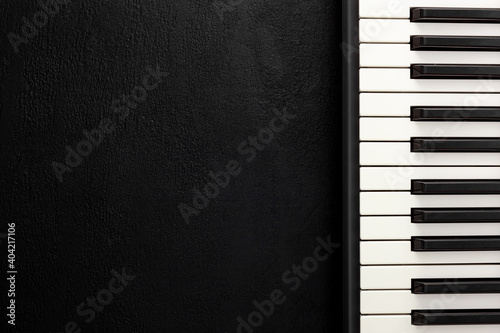 Desk of musician for songwriter work set with headphones and synthesizer