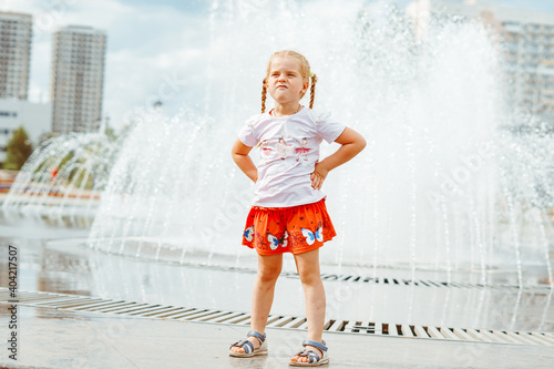 little girl near the fountain