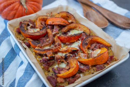 baked pumpkin polenta pizza with cheese photo