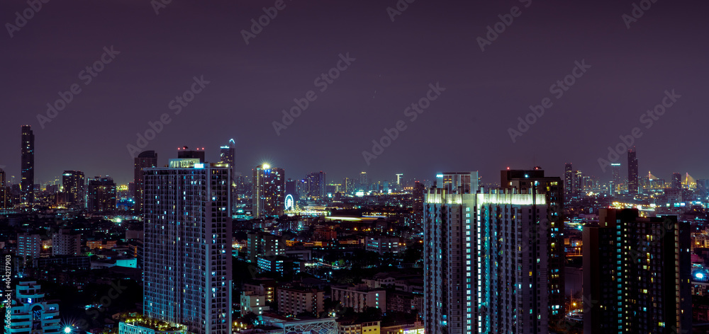 Cityscape of modern building in the night. Modern architecture office building. Skyscraper with beautiful evening sky. Business and financial center building. Apartment in the city with night light.