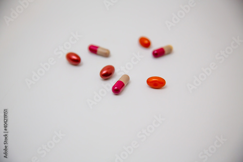 Colorful pills isolated on white background with copy space, top view