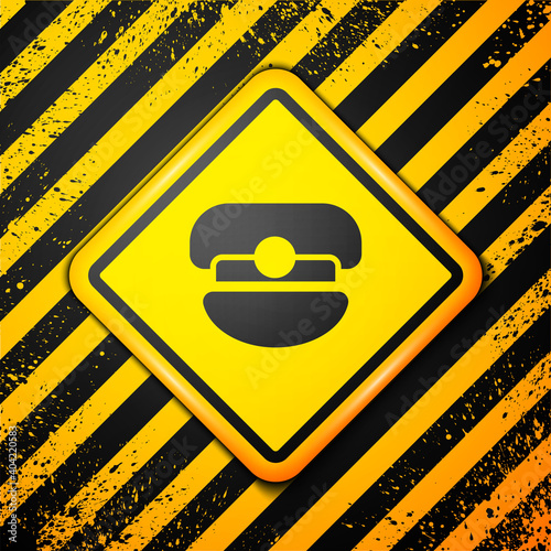 Black Captain hat icon isolated on yellow background. Warning sign. Vector.