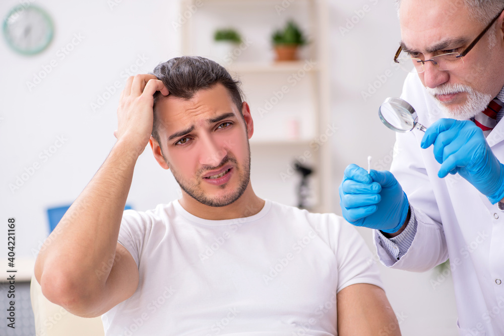 Young man visiting experienced doctor dermatologist Young man visiting experienced doctor dermatologist