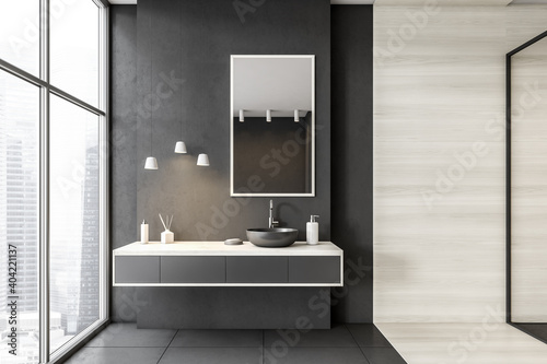Grey and white bathroom with shower, sink and mirror near big window photo