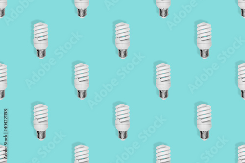 Light bulb seamless pattern. Lighting bulbs on an aquamarine background.