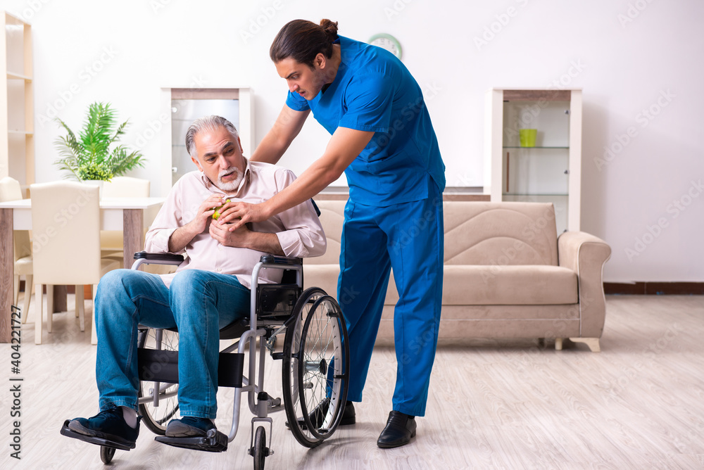 Old man in wheel-chair and young bad caregiver indoors