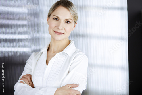 Friendly adult business woman standing straight. Business headshot or portrait in office Free Download Friendly adult business woman standing straight. Business headshot or portrait in office - GFXLoad